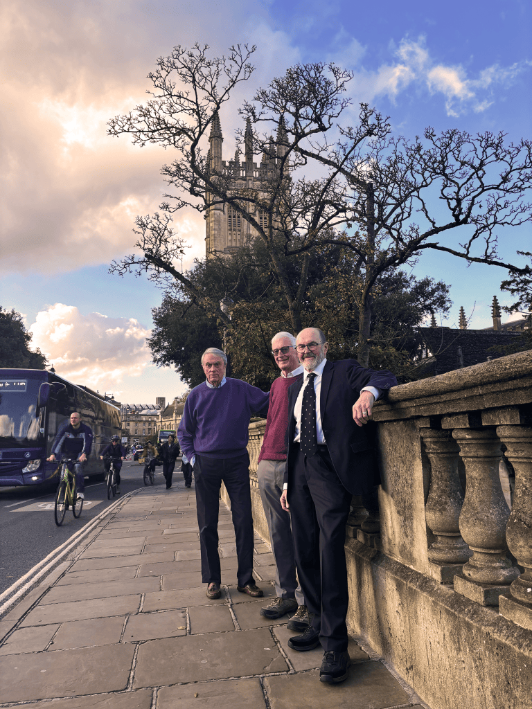 Robert, John, and Glyn on Magdalen Bridge with the tower in the background.