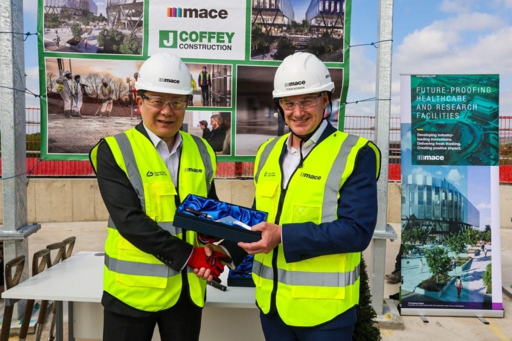 Magdalen Bursar, Yong Shen, at the topping out ceremony with Robin Norman, Project Director at Mace.