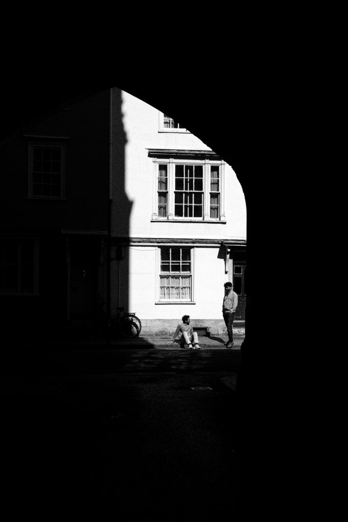 Two men in strong sunlight