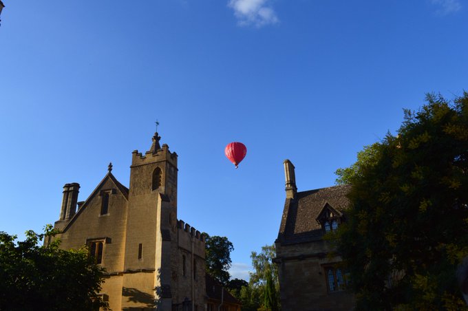 Hot air balloon flies over Magdalen College