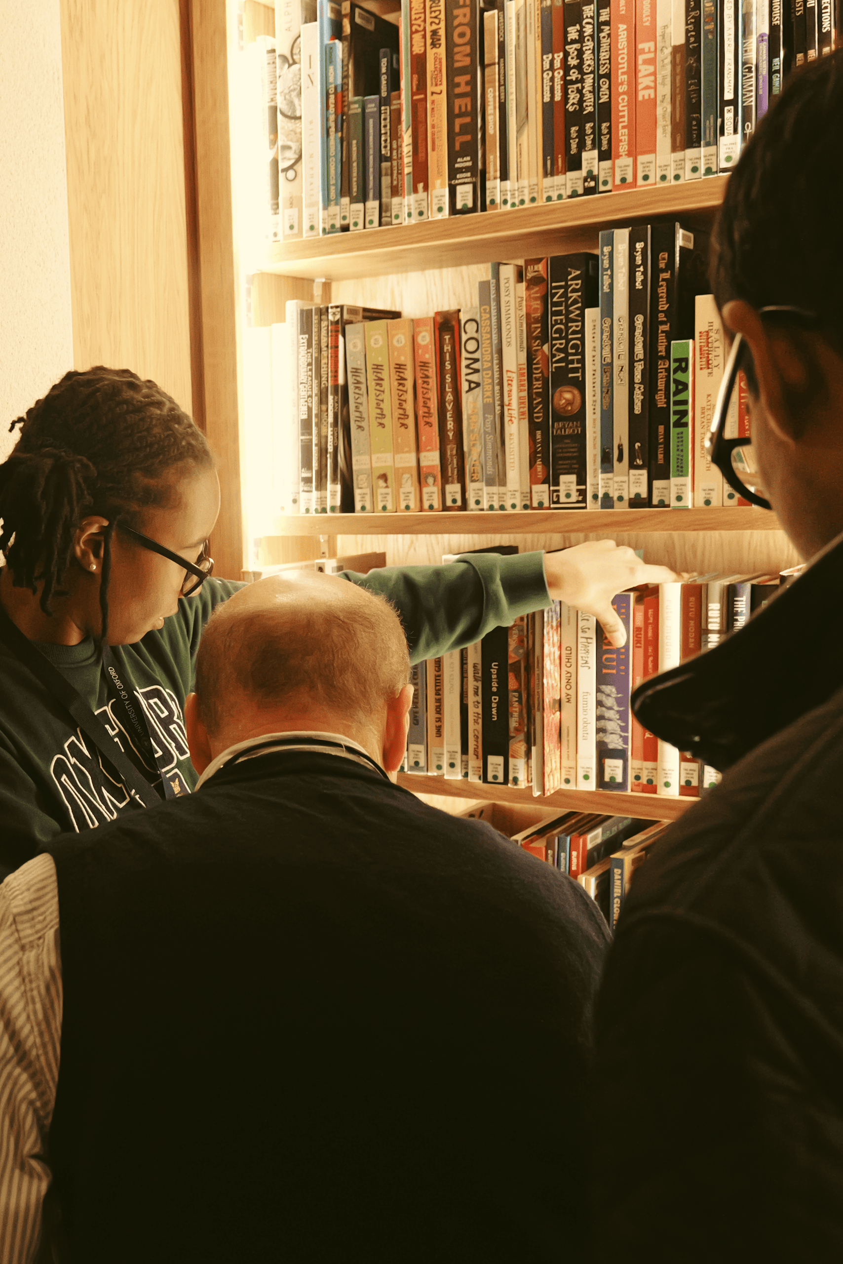 Students and Peter Kessler looking at the collection