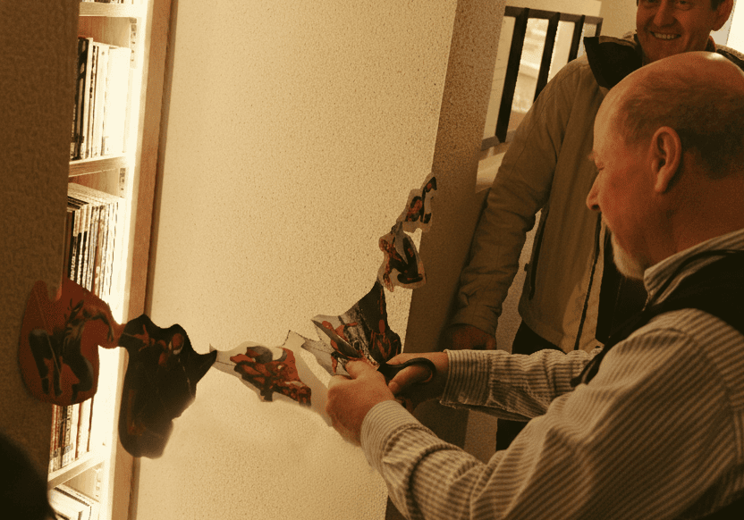 Peter Kessler cutting the spiderman ribbon for the books