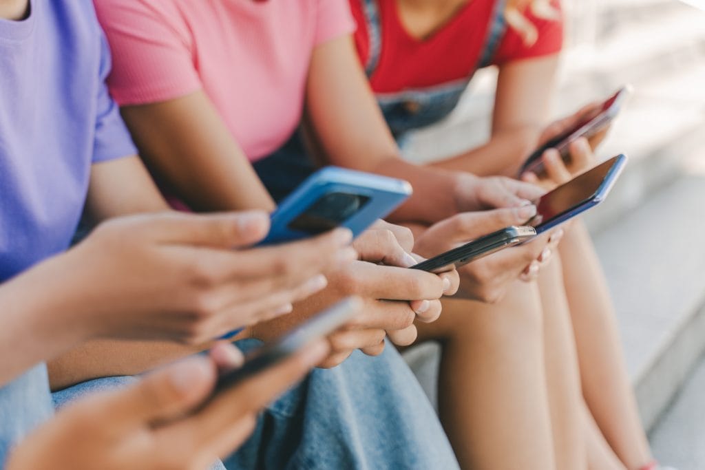 Picture of children on their phones