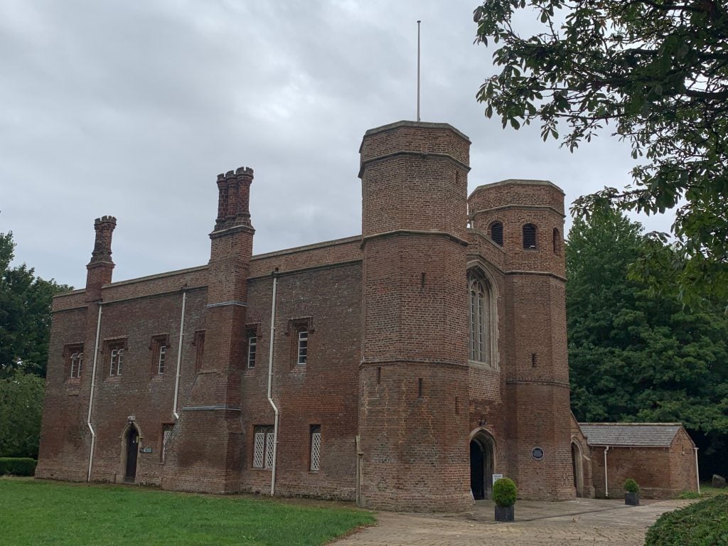 Magdalen College Museum, Lincoln - a tall red brick building with turrets and towers