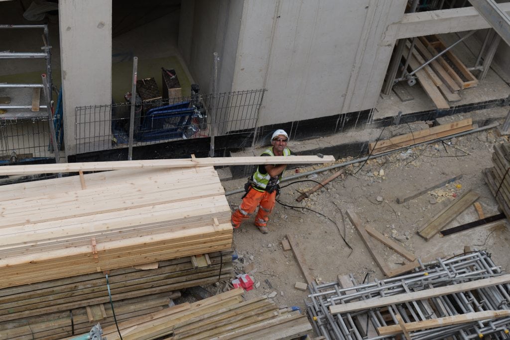 Construction worker on site at Magdalen College Oxford during building renovation.