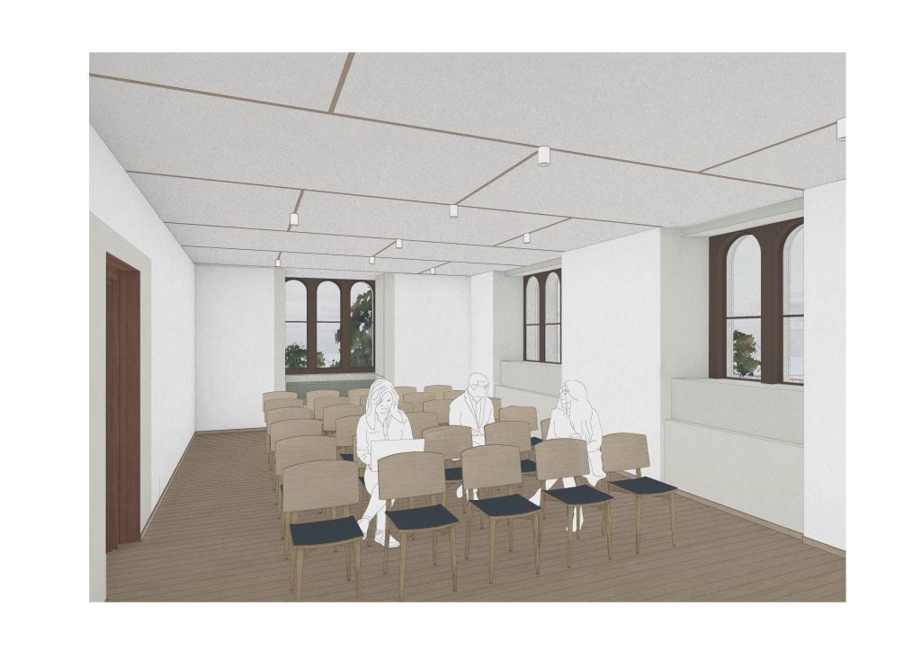 Architectural rendering of the new Austin Gill Room showing rows of wooden chairs with dark upholstered seats facing forward, with line-drawn figures sitting in them. The room features white walls, wooden flooring, recessed ceiling lights, and traditional leaded arched windows looking out onto greenery. There's no visible text in the image.